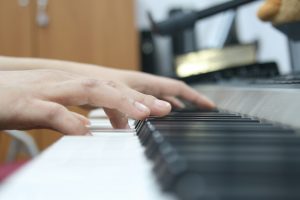 Hand playing keys